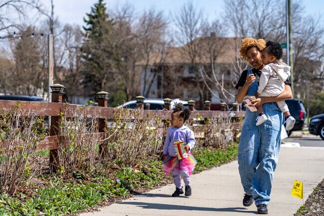 Residents of Boston-Edison enjoy walking outside on its spacious tree-lined sidewalks.