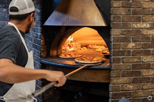 Rosedale Brick Oven makes fresh pizzas using traditional methods near Autumn Woods.