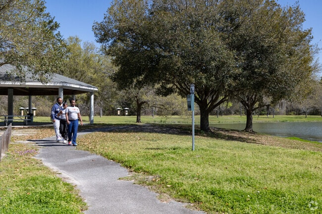 Tatemville residents enjoy walking around the neighborhood pond.