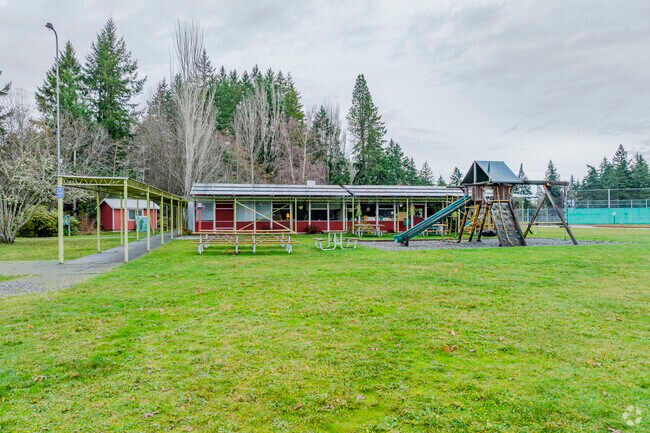 Play structures and view of the school at Harbor School.