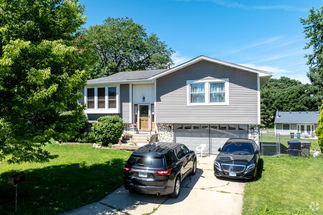 Shared home design elements nearby include low-pitched roofs, vinyl siding and stone or brick.