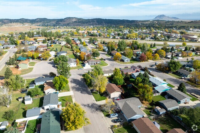 Homes in Sturgis reside in the valleys beneath the vast wilderness of the Black Hills National Forest.