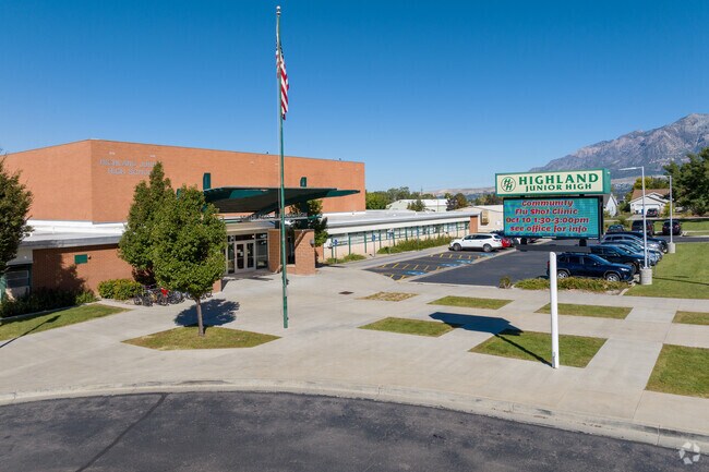 An American flag stands close to the front entrance at Highland Junior High.
