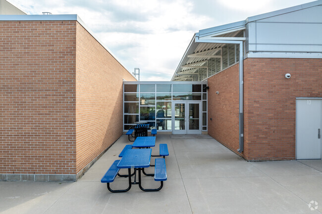 Students can learn and have lunch outside at several picnic tables.