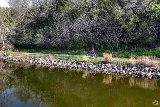Lake Susan provides a beautiful backdrop for cyclists along its paved trails.