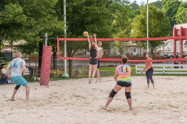 A heated volleyball game goes on into the night at Barefield Park in Jalappa.