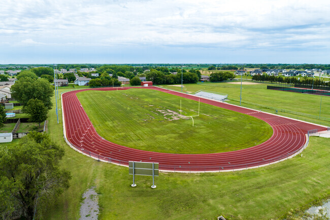 There is a great looking football field surrounded by a track in Maize Middle School.