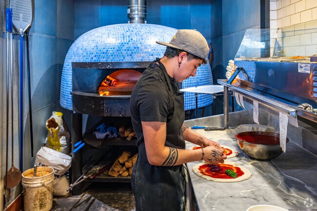 Il Ritrovo in Downtown Sheboygan prepares meals in front of guests.
