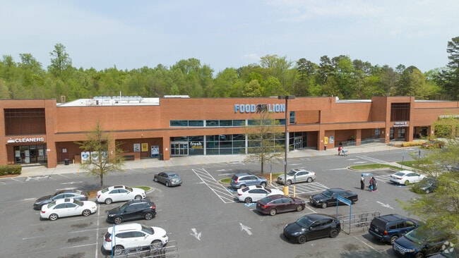 Food Lion anchors the Cheshire Shopping Center near West Sugar Creek.