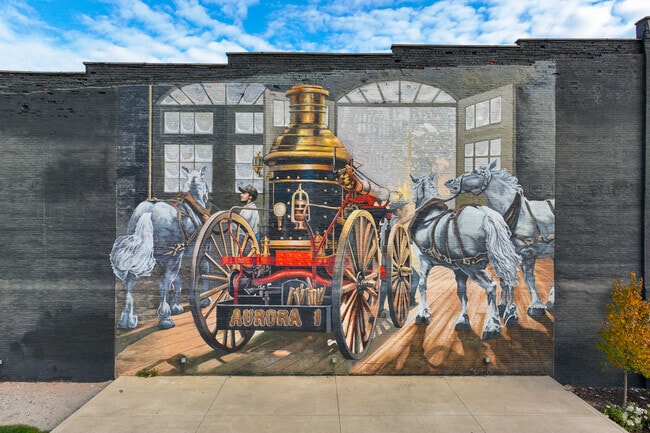 Aurora town center has historic paintings on the street walls.