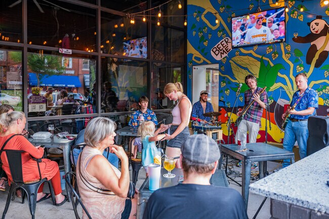 Families enjoy the music during the 2nd Friday Norman Art Walk.