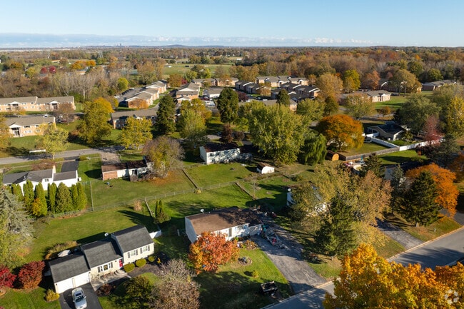 A neighborhood in Henrietta features midcentury homes and tree-lined streets.