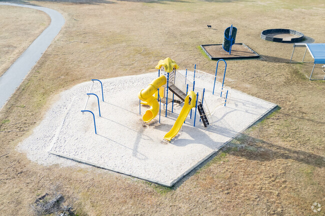 A modern playground for children at John R. Lawrence Elementary School.
