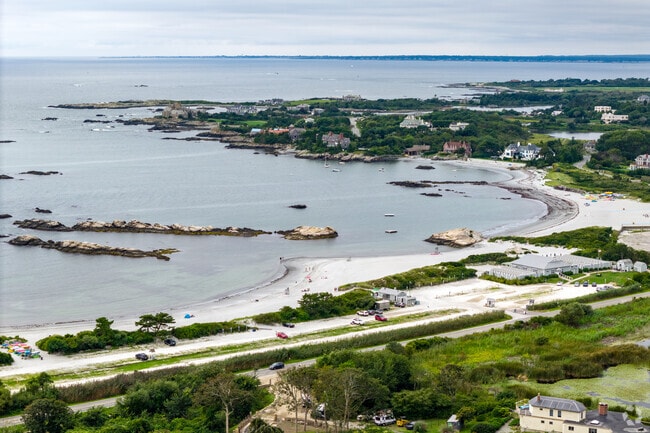 This aerial view of Gooseberry Beach in the Lily-Almy Pond neighborhood shows the calm waters.