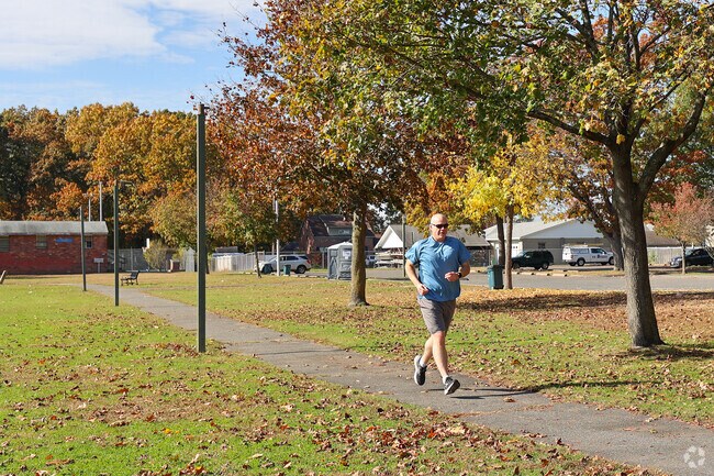 Joggers enjoy a run through Ray Ash Park in Aldenville.