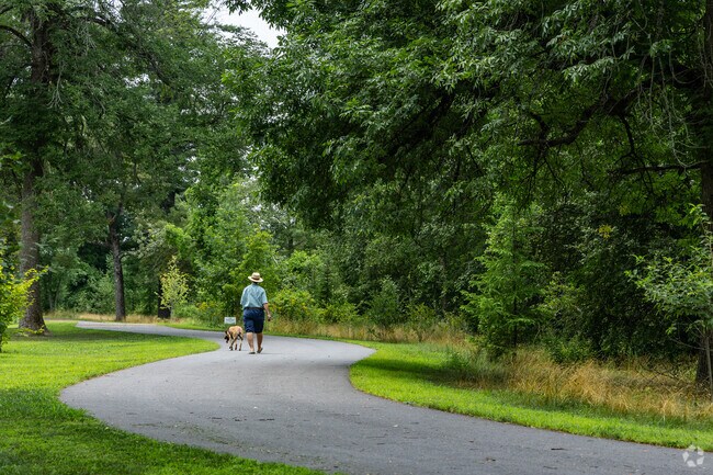 A South End resident enjoys a walk along the Merrimack River.
