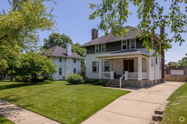 This two-story home in Westwood has a garage located behind the fence .