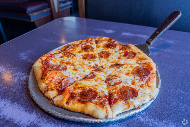 Grab a hand-made pizza from Cadillac Cafe in Meadow Lakes.