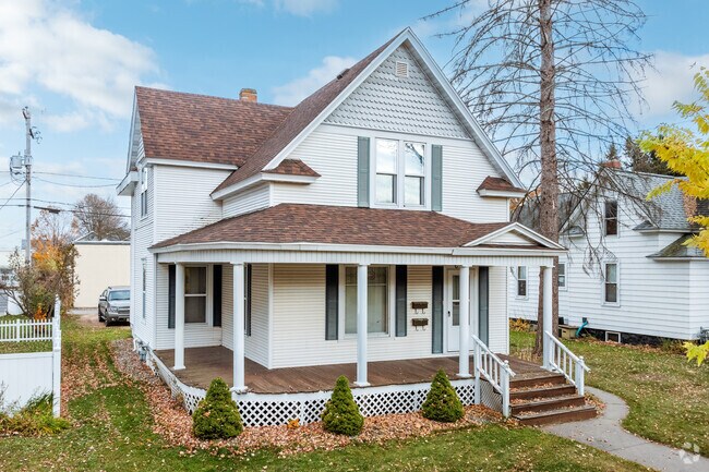 This traditional architectural home in Werle Park has a well maintained yard.