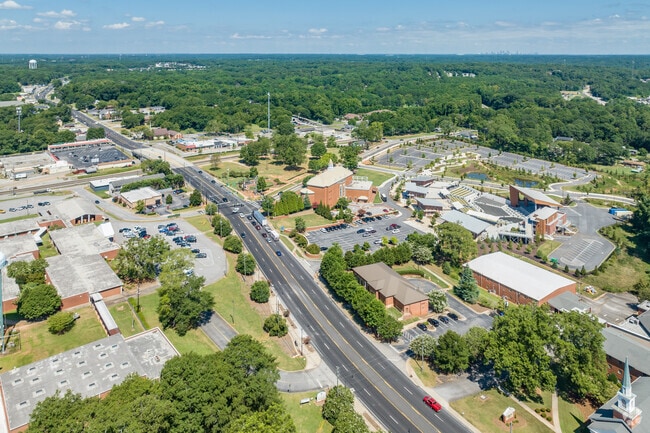 Stockbridge town center with Atlanta in the distance seen from the air.