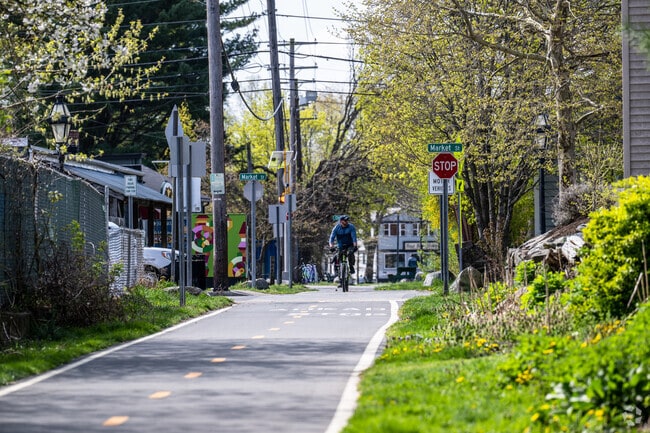 Touisset Highlands residents bike the East Bay Bike Path through downtown Warren.