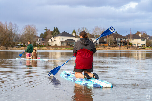Residents enjoy paddle boarding and fishing at Bethany Lake Park.