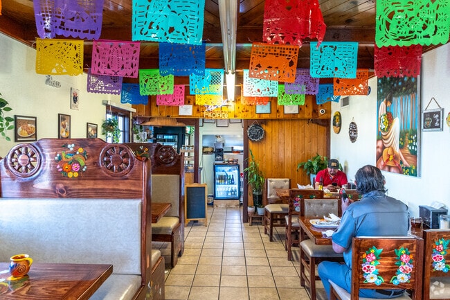 Los Olivos Mexican Restaurant is a community favorite in Trumbull Village for its birria tacos, welcoming with a down-home atmosphere and color-splashed walls.