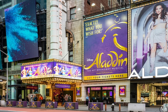Visitors flock to Broadway theaters in Times Square.