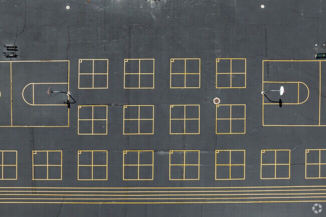 Four square and basketball courts create symmetry at Heartland Elementary School.