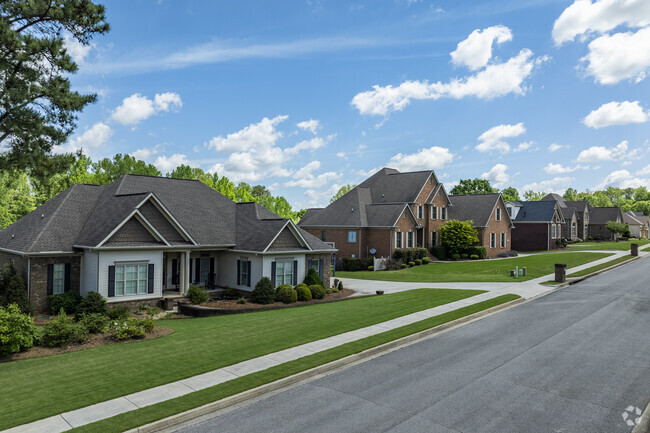 Many of the yards of homes in Merdianville have well manicured and maintained lawns.