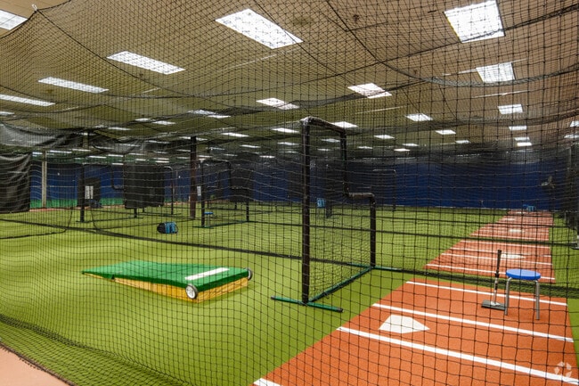 A professional batting cage for training at Greensboro batting center in O Henry Oaks.
