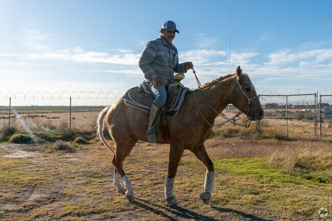 Ranchers often ride horseback through the Edison neighborhood of Bakersfield.