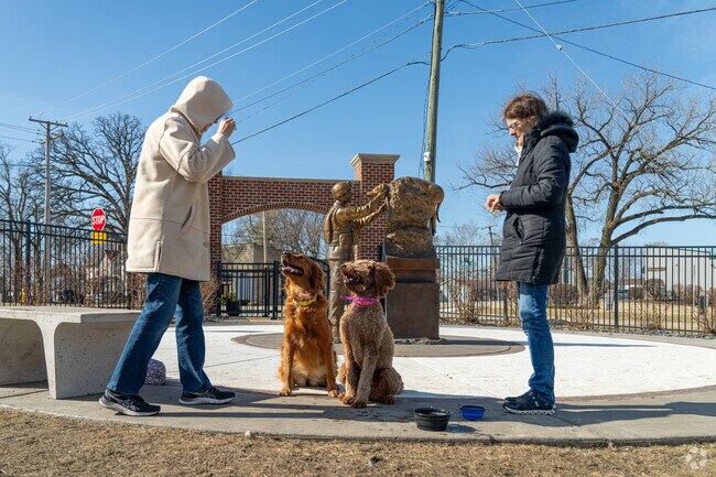 Local Minooka residents enjoy a bright sunny morning at Veterans Park with their furry friends.