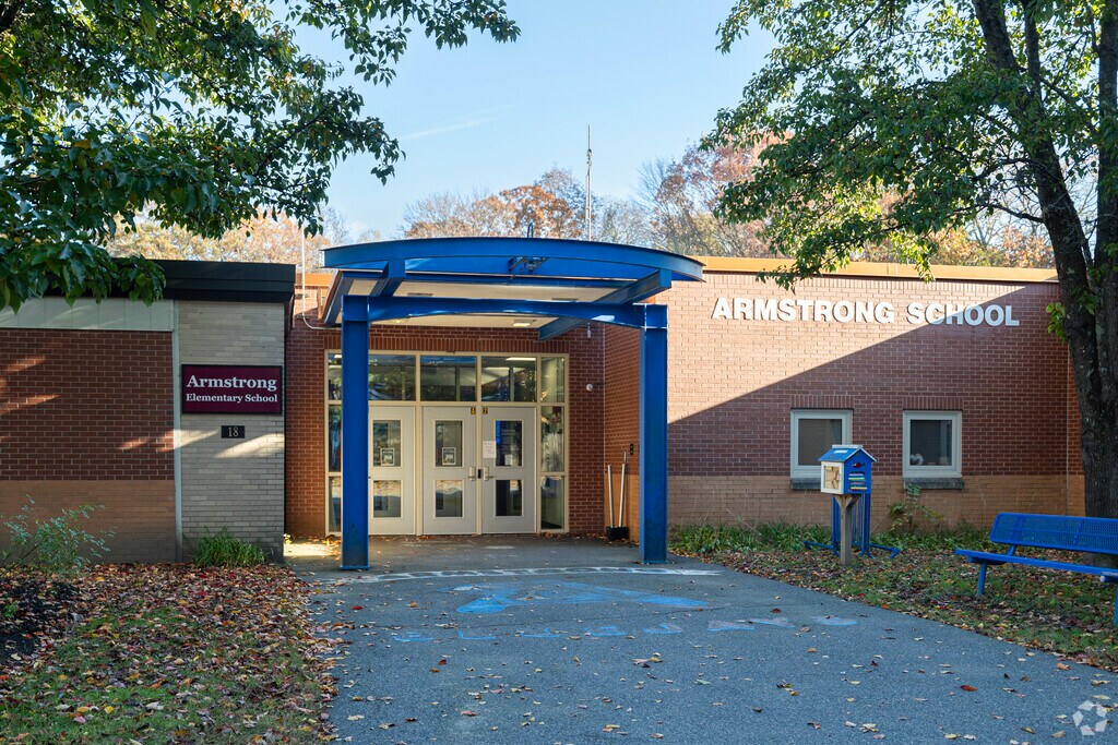 The Main entrance of Armstrong Elementary School can be found behind Sarah W. Gibbons School.