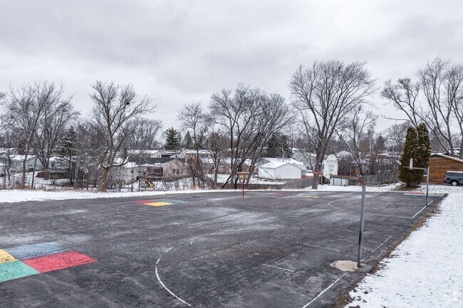 Oakhill Elementary features basketball courts and an asphalt area for students to play.