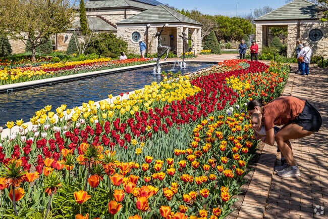 Stop and smell the flowers at the Relex by the water at the the Kauffman Legacy Memorial Park.