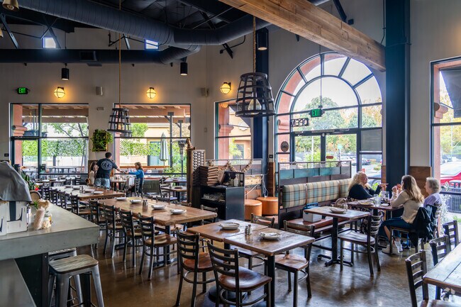 Indulge in The Creek Eatery's wood-fired pizzas near Richmond Ranch.