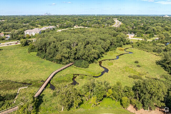 Traverse through miles of wooden boardwalk and paved paths at Nine Mile Creek Regional Trail.