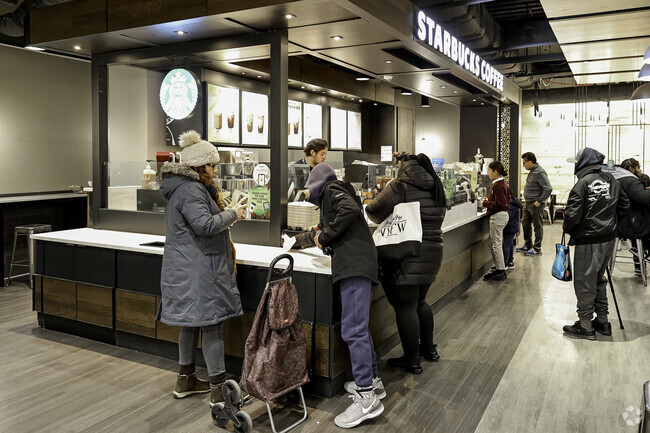 Enjoying coffee with friends at Starbucks in the Marble Hill neighborhood.