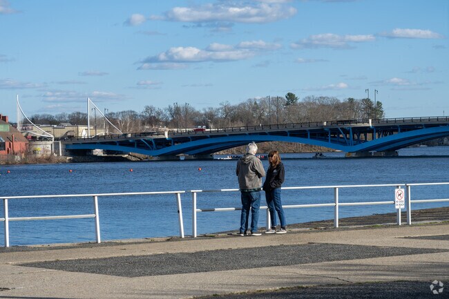 A couple enjoy the view at Regatta Point in Worcester.