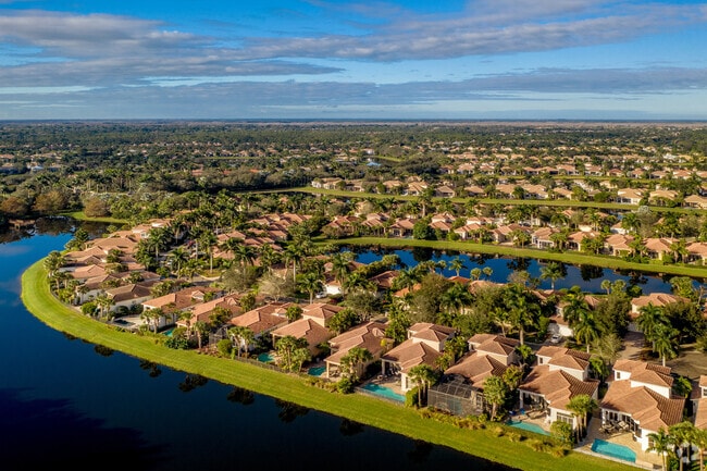 Dozens of traditional one-story homes with resort-style amenities are visible in Mirasol, Florida.