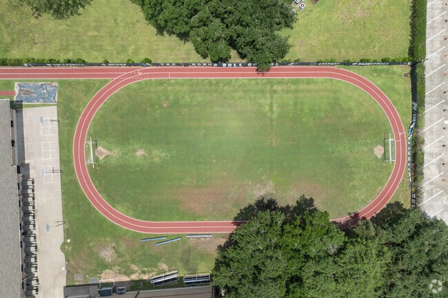 The campus features modern facilities and outdoor play areas.