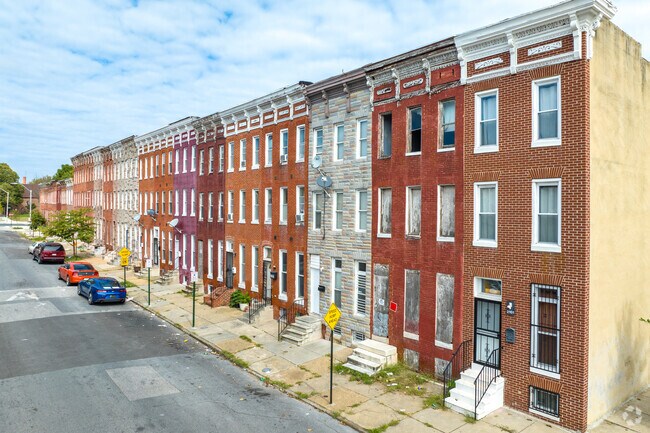 Three story brick row homes all have their own character in Druid Heights.