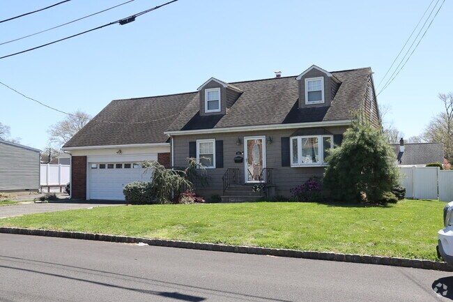 There are many cape cod homes in Kenilworth with attached garages.