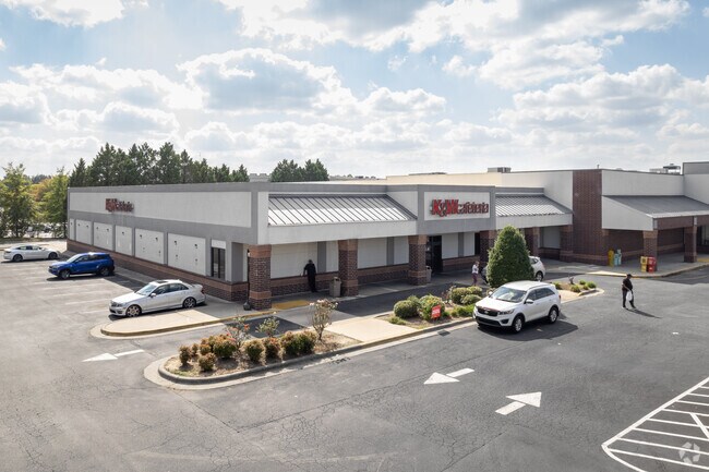 Pedestrians walking out of the K&W Cafeteria near Polecat Creek.
