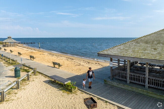 Locals relax on the beach at the Islip Town Beach.