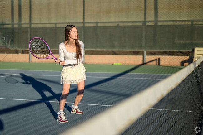 Play a tennis match with some friends at Doris Davies Park.