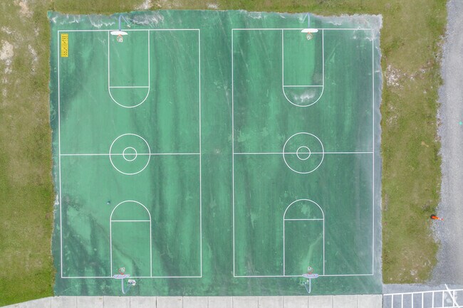 Kids enjoy outdoor play on the sports courts at Rodney Cox Elementary.