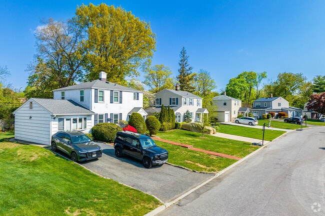 These colonials in Roslyn Heights have different roof styles.