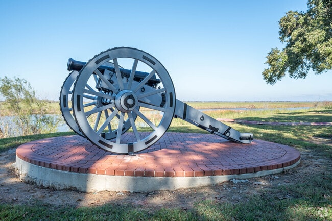 A decorative war cannon sits at a park in Winnie, Texas.